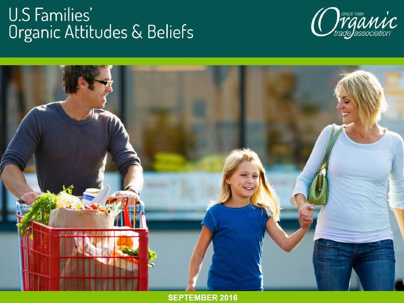 Family leaving supermarket with cart - man, woman and girl